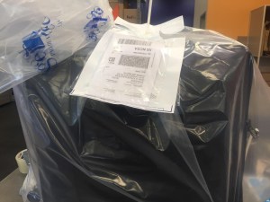 It's zip-tied and shrink wrapped and tagged for French customs with a photo of my passport attached for French customs. 